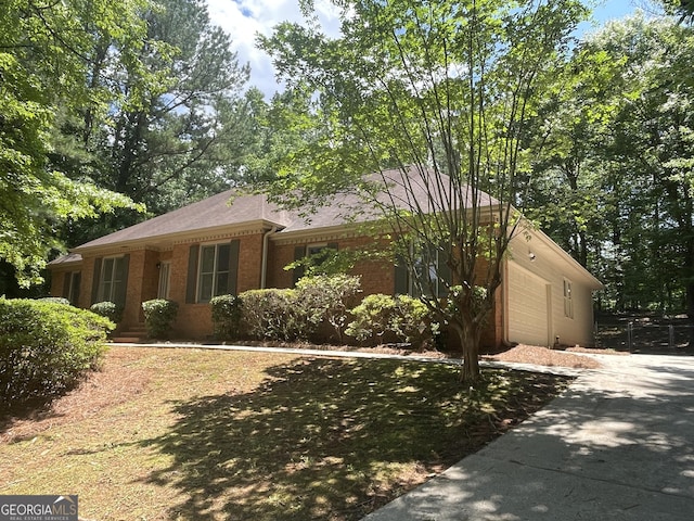 56 Ridgewood Ct, Mcdonough, GA 30252 - ranch-style home with brick siding, driveway, and a garage