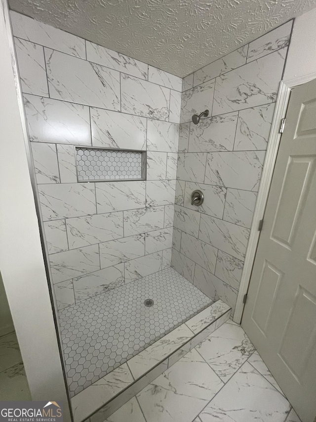 56 Ridgewood Ct, Mcdonough, GA 30252 - bathroom with marble finish floors and a stall shower
