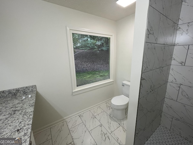 56 Ridgewood Ct, Mcdonough, GA 30252 - full bathroom featuring marble look tile flooring and a stall shower