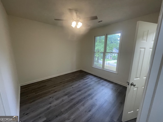 56 Ridgewood Ct, Mcdonough, GA 30252 - unfurnished room with ceiling fan and dark wood finished floors
