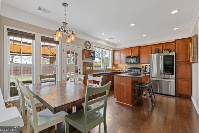 610 Syemore Pass, Canton, GA 30115 - dining room featuring dark wood-style flooring, ornamental molding, recessed lighting, and a chandelier
