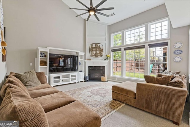 610 Syemore Pass, Canton, GA 30115 - carpeted living area featuring ceiling fan, high vaulted ceiling, and a fireplace with flush hearth