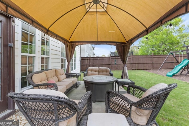 610 Syemore Pass, Canton, GA 30115 - fenced backyard with an outdoor living space with a fire pit, a gazebo, a playground, and a patio