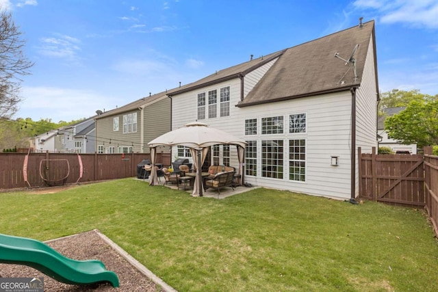 610 Syemore Pass, Canton, GA 30115 - rear view of house featuring a patio area, a fenced backyard, an outdoor hangout area, a playground, and roof with shingles