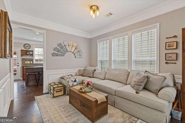 610 Syemore Pass, Canton, GA 30115 - living room with crown molding, dark wood finished floors, and wainscoting