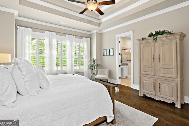 406 Horizon Trl, Canton, GA 30114 - bedroom with dark wood finished floors, a tray ceiling, ornamental molding, ensuite bath, and ceiling fan