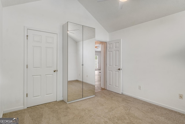 14 Winter Ln, Newnan, GA 30265 - unfurnished bedroom with carpet, lofted ceiling, ceiling fan, and a closet