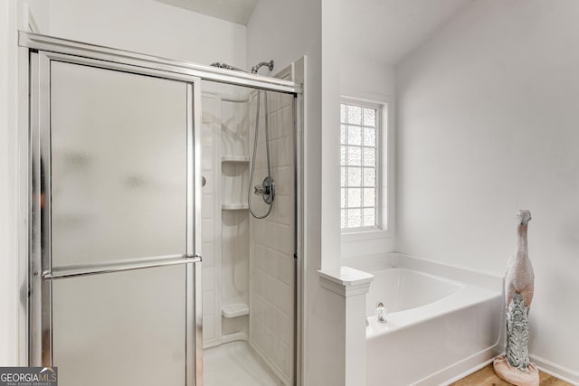 14 Winter Ln, Newnan, GA 30265 - bathroom featuring a garden tub, a shower stall, and wood finished floors