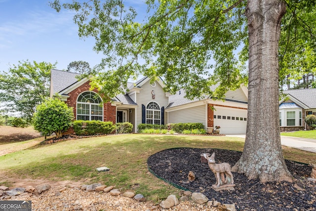 14 Winter Ln, Newnan, GA 30265 - traditional-style house featuring brick siding, roof with shingles, a garage, and a front lawn