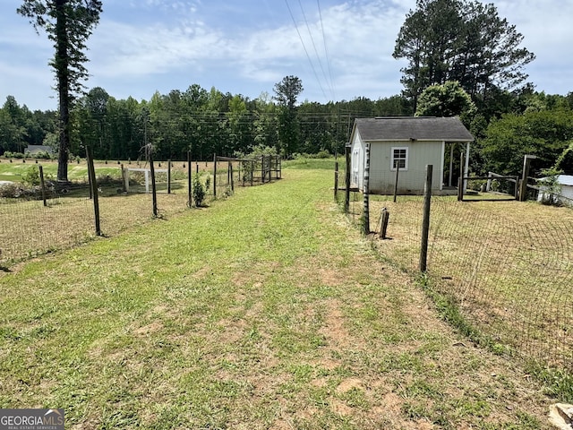 14 Winter Ln, Newnan, GA 30265 - view of yard with an outdoor structure and a wooded view