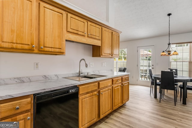 14 Winter Ln, Newnan, GA 30265 - kitchen with black dishwasher, light wood-style floors, decorative light fixtures, and brown cabinetry