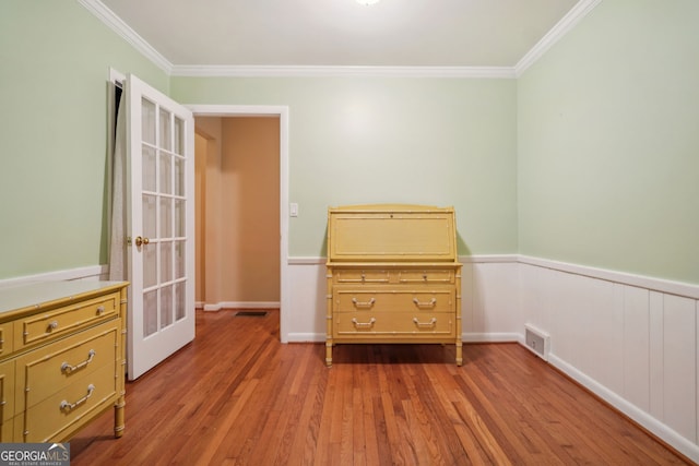 2790 Laurel Ridge Dr, Decatur, GA 30033 - bedroom with wood finished floors, crown molding, and a wainscoted wall