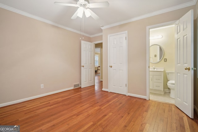2790 Laurel Ridge Dr, Decatur, GA 30033 - unfurnished bedroom with light wood-type flooring, ornamental molding, connected bathroom, and a ceiling fan