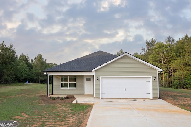 331 Red Berry Rd, Jackson, GA 30233 - view of front of home with concrete driveway, a front yard, a porch, and a garage