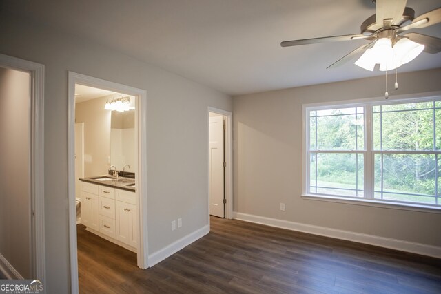 331 Red Berry Rd, Jackson, GA 30233 - unfurnished bedroom with dark wood finished floors, ensuite bath, and bar with sink
