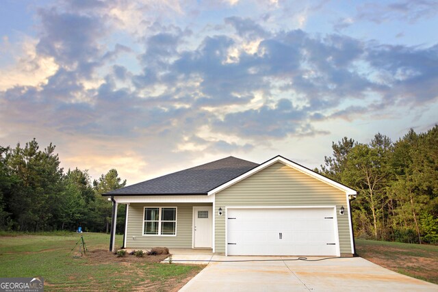 331 Red Berry Rd, Jackson, GA 30233 - view of front of property with concrete driveway, a front yard, a garage, and a porch