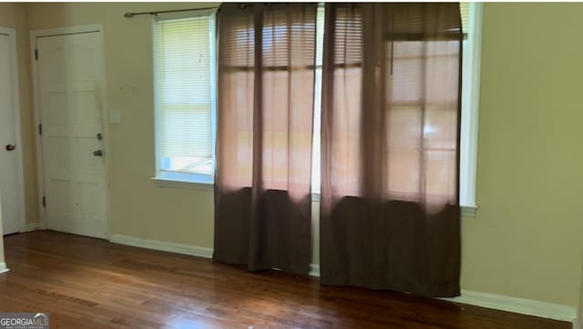 6521 Menlo Way, Rex, GA 30273 - empty room with wood finished floors and baseboards