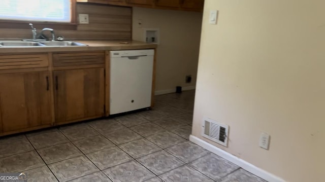 6521 Menlo Way, Rex, GA 30273 - kitchen with dishwasher, light tile patterned floors, and light countertops
