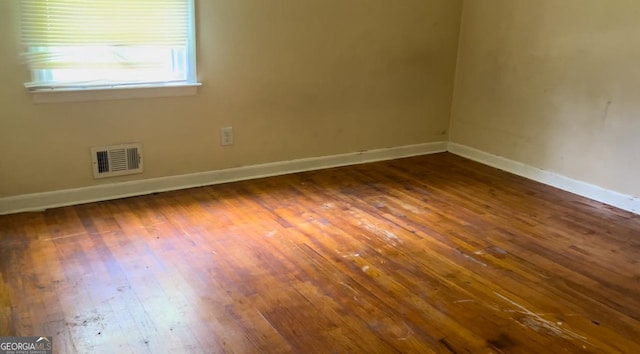 6521 Menlo Way, Rex, GA 30273 - empty room featuring dark wood-type flooring and baseboards