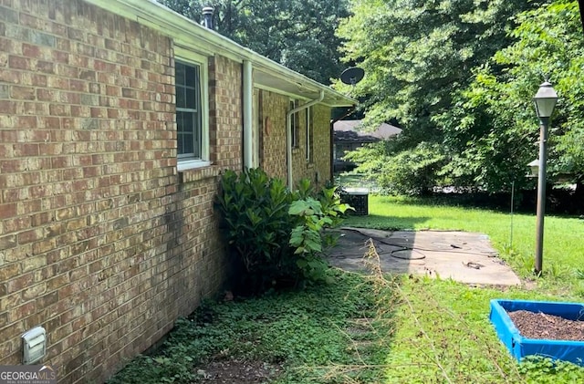 6521 Menlo Way, Rex, GA 30273 - view of green lawn with a patio area