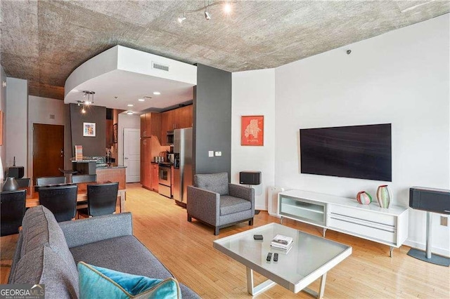 943 Peachtree St NE Unit 902, Atlanta, GA 30309 - living area with light wood-type flooring