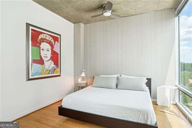 943 Peachtree St NE Unit 902, Atlanta, GA 30309 - bedroom featuring wood finished floors and a ceiling fan