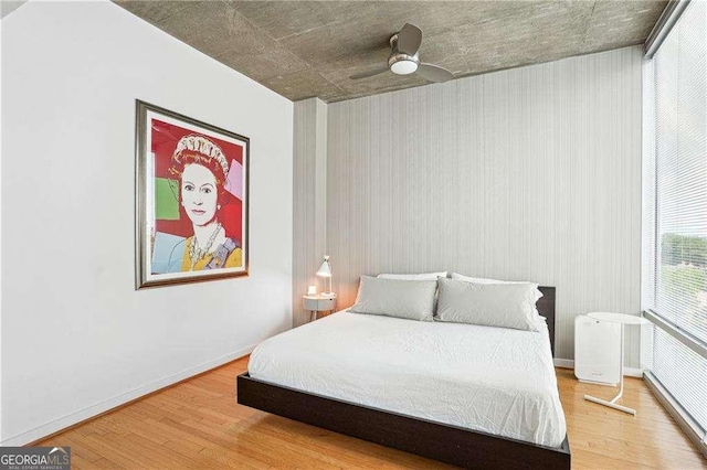 943 Peachtree St NE Unit 902, Atlanta, GA 30309 - bedroom with wood finished floors and ceiling fan