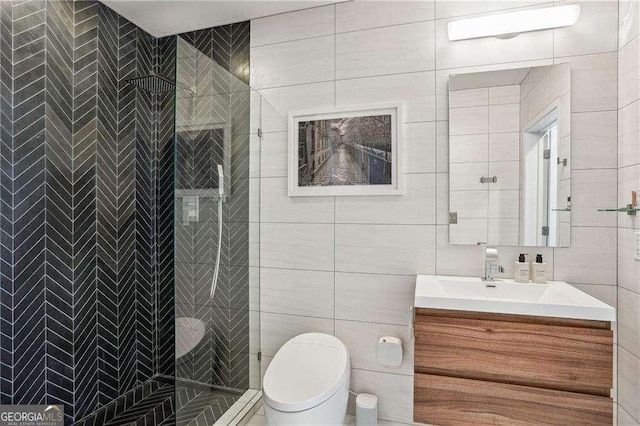943 Peachtree St NE Unit 902, Atlanta, GA 30309 - bathroom featuring tile walls, vanity, and tiled shower