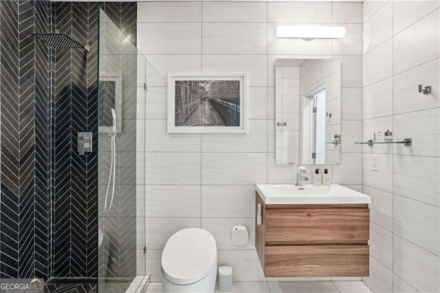 943 Peachtree St NE Unit 902, Atlanta, GA 30309 - bathroom with vanity, tile walls, and a tile shower
