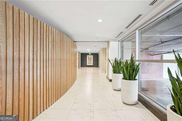 943 Peachtree St NE Unit 902, Atlanta, GA 30309 - hallway featuring light marble finish floors and recessed lighting
