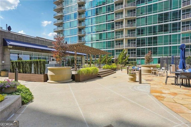 943 Peachtree St NE Unit 902, Atlanta, GA 30309 - view of community featuring a patio and a pergola