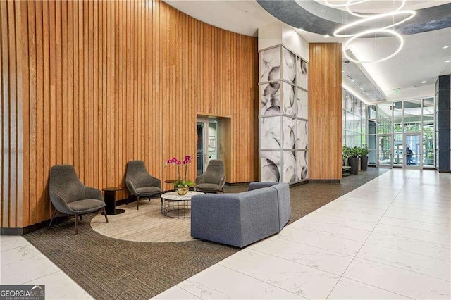 943 Peachtree St NE Unit 902, Atlanta, GA 30309 - common area with a wall of windows, wooden walls, and a high ceiling