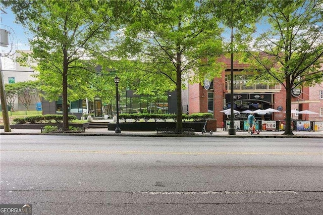 943 Peachtree St NE Unit 902, Atlanta, GA 30309 - view of asphalt road with curbs, street lights, and sidewalks