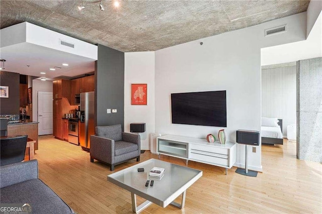 943 Peachtree St NE Unit 902, Atlanta, GA 30309 - living room with light wood-style flooring