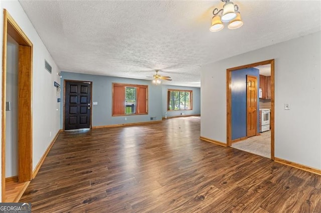 137 Trickum Hills Dr, Woodstock, GA 30188 - unfurnished living room featuring wood finished floors, ceiling fan, a textured ceiling, and a chandelier
