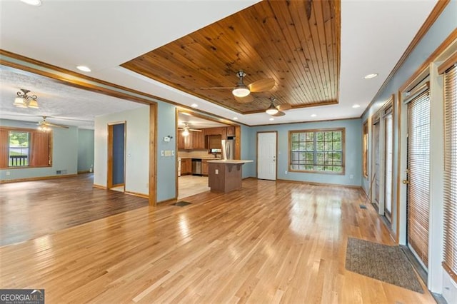 137 Trickum Hills Dr, Woodstock, GA 30188 - unfurnished living room featuring ceiling fan, a tray ceiling, light wood-style flooring, wooden ceiling, and ornamental molding