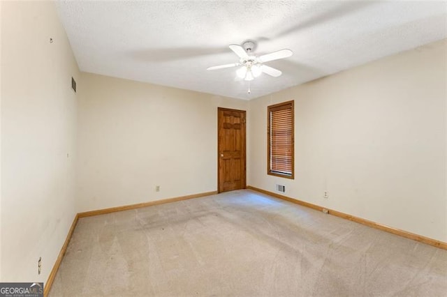 137 Trickum Hills Dr, Woodstock, GA 30188 - spare room with light colored carpet, a ceiling fan, and a textured ceiling