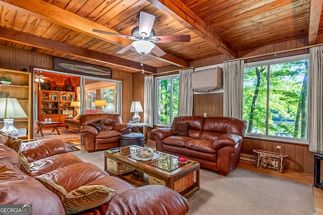 1813 Freeman Rd, Jonesboro, GA 30236 - living room with wooden walls, a wood ceiling with exposed beams, ceiling fan, and a baseboard radiator