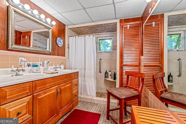 1813 Freeman Rd, Jonesboro, GA 30236 - bathroom with tile walls, a stall shower, healthy amount of natural light, and double vanity