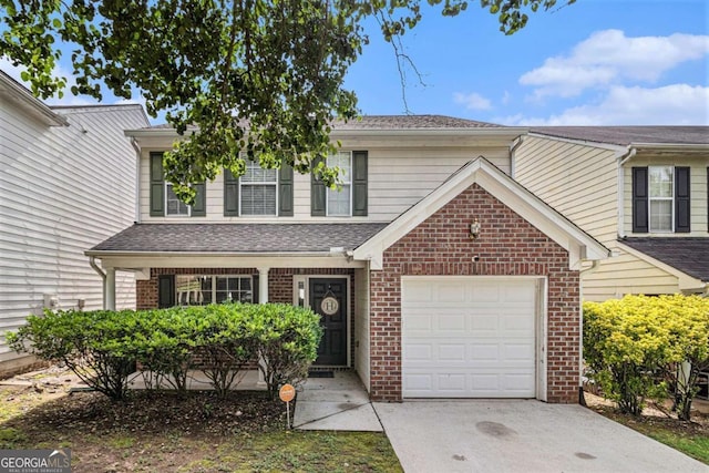 2437 Charleston Pointe Ct SE, Atlanta, GA 30316 - traditional-style home featuring brick siding, driveway, a garage, and a shingled roof