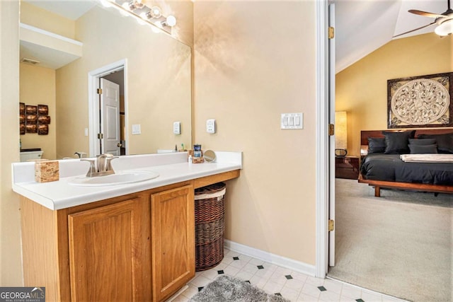 2437 Charleston Pointe Ct SE, Atlanta, GA 30316 - bathroom with a ceiling fan, vanity, vaulted ceiling, and tile patterned flooring