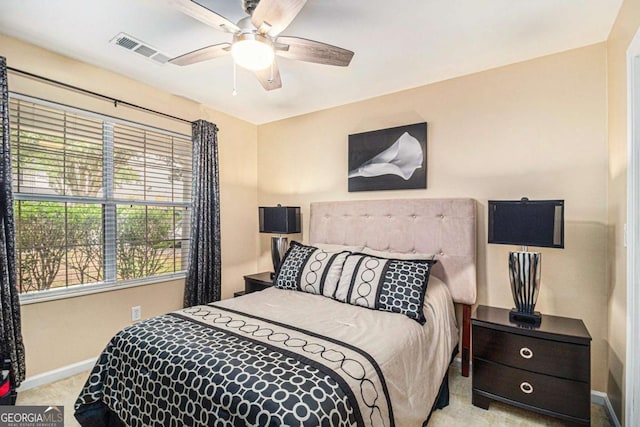 2437 Charleston Pointe Ct SE, Atlanta, GA 30316 - carpeted bedroom with multiple windows and a ceiling fan