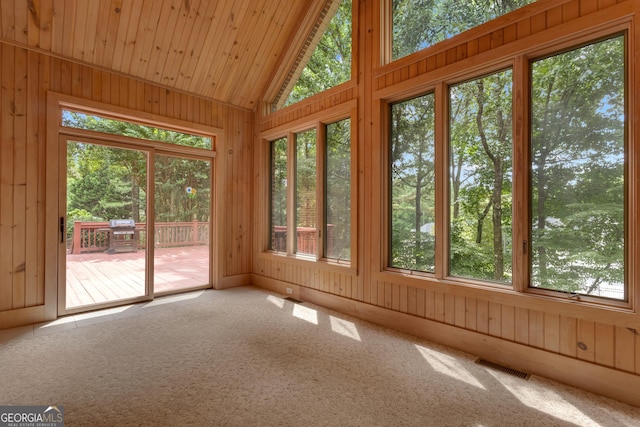 821 Carnellian Ln, Peachtree City, GA 30269 - unfurnished sunroom featuring vaulted ceiling, wooden walls, carpet flooring, and wooden ceiling