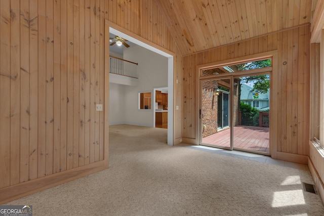 821 Carnellian Ln, Peachtree City, GA 30269 - carpeted spare room with wood walls, a ceiling fan, wood ceiling, and high vaulted ceiling
