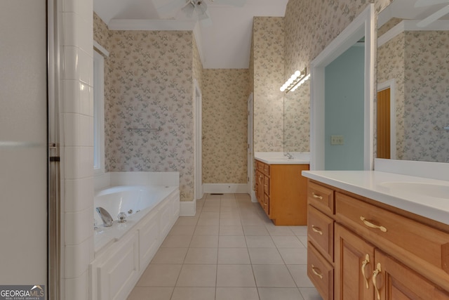 821 Carnellian Ln, Peachtree City, GA 30269 - bathroom featuring two vanities, tile patterned flooring, a bath, wallpapered walls, and ceiling fan