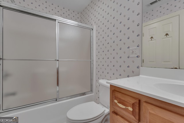 821 Carnellian Ln, Peachtree City, GA 30269 - full bathroom featuring wallpapered walls, vanity, and shower / bath combination with glass door