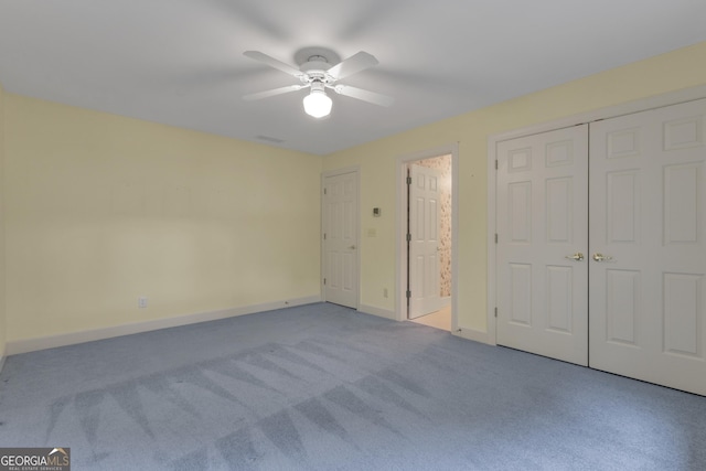 821 Carnellian Ln, Peachtree City, GA 30269 - unfurnished bedroom with carpet floors, ceiling fan, and a closet