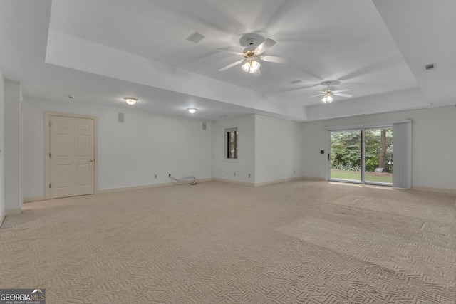 821 Carnellian Ln, Peachtree City, GA 30269 - unfurnished room featuring a tray ceiling, a ceiling fan, and light colored carpet