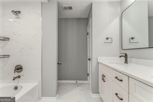 7074 Babbling Brook Dr, Jonesboro, GA 30236 - bathroom featuring marble look tiles, double vanity, a textured ceiling, and  shower combination