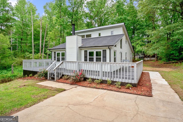 50 Hearthstone Dr, Newnan, GA 30263 - view of front of home with a wooden deck and a chimney